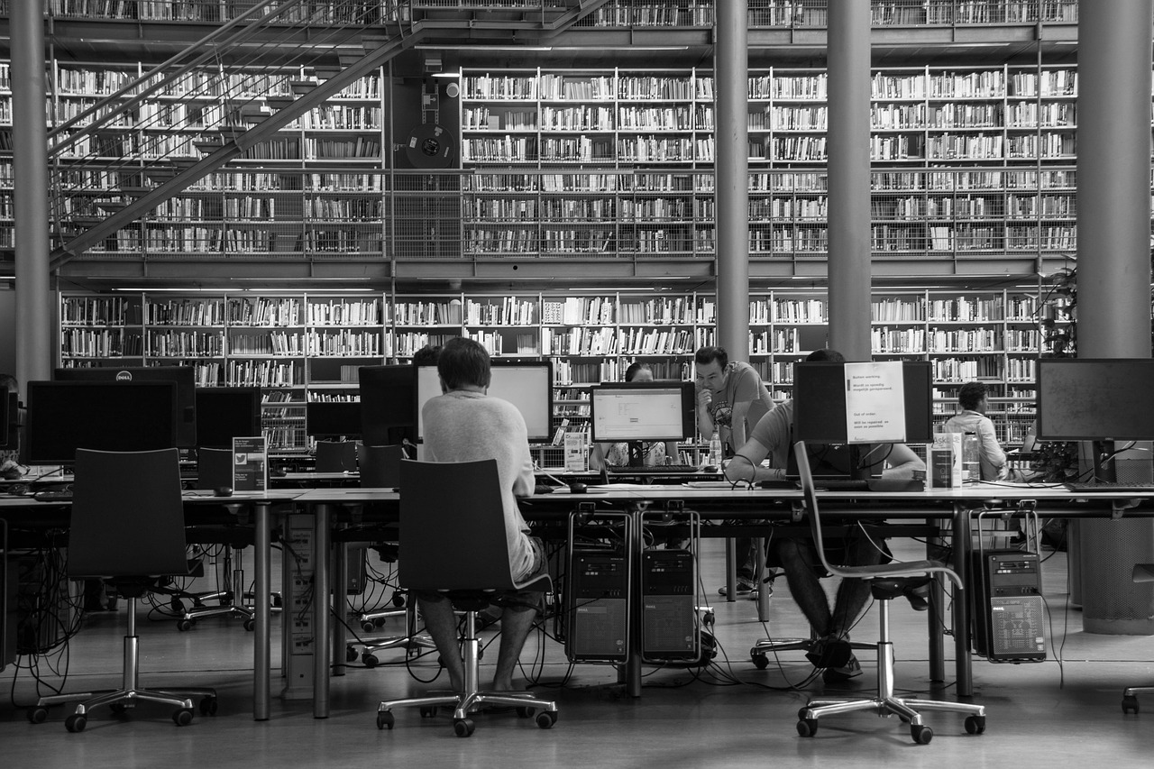 Students and teacher utilizing the facility of library